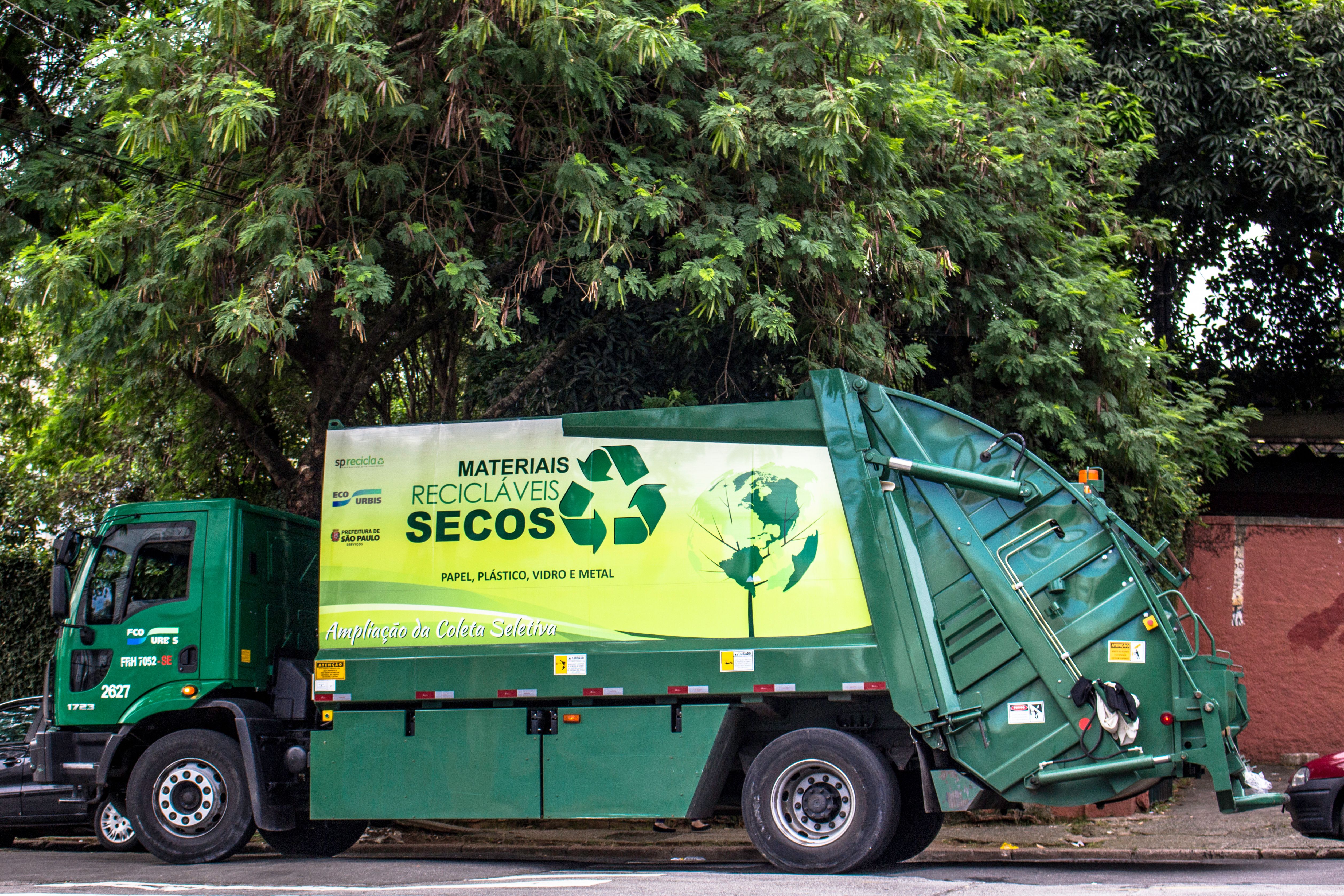 A garbage truck on a street. 